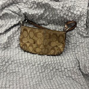Woman’s Coach Signature Canvas and Leather Wristlet Tan/Brown Bag